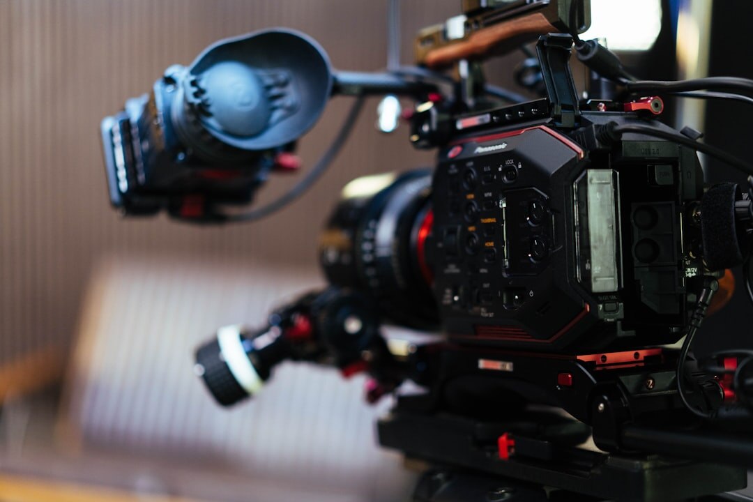 Close-up of professional broadcast camera and lighting equipment in a studio